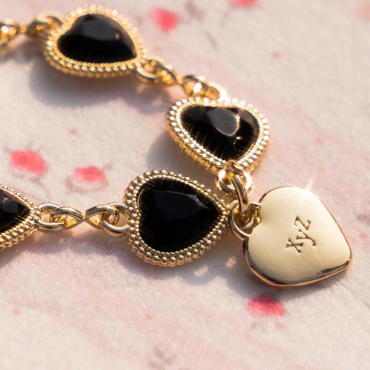 Heartstring charm strap in Black, crystal detail