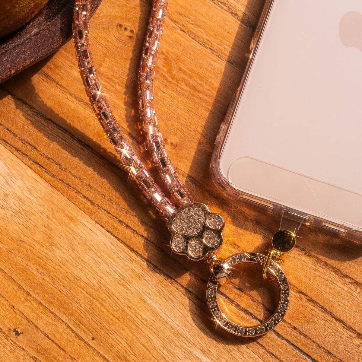 Pawfect charm strap in Rose Gold, flat lay with phone - all-groups